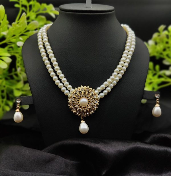Radiant Double-Layered Pearl Necklace with Golden Sunburst Pendant & Earrings