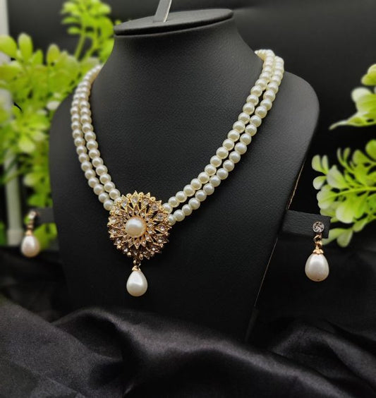 Radiant Double-Layered Pearl Necklace with Golden Sunburst Pendant & Earrings